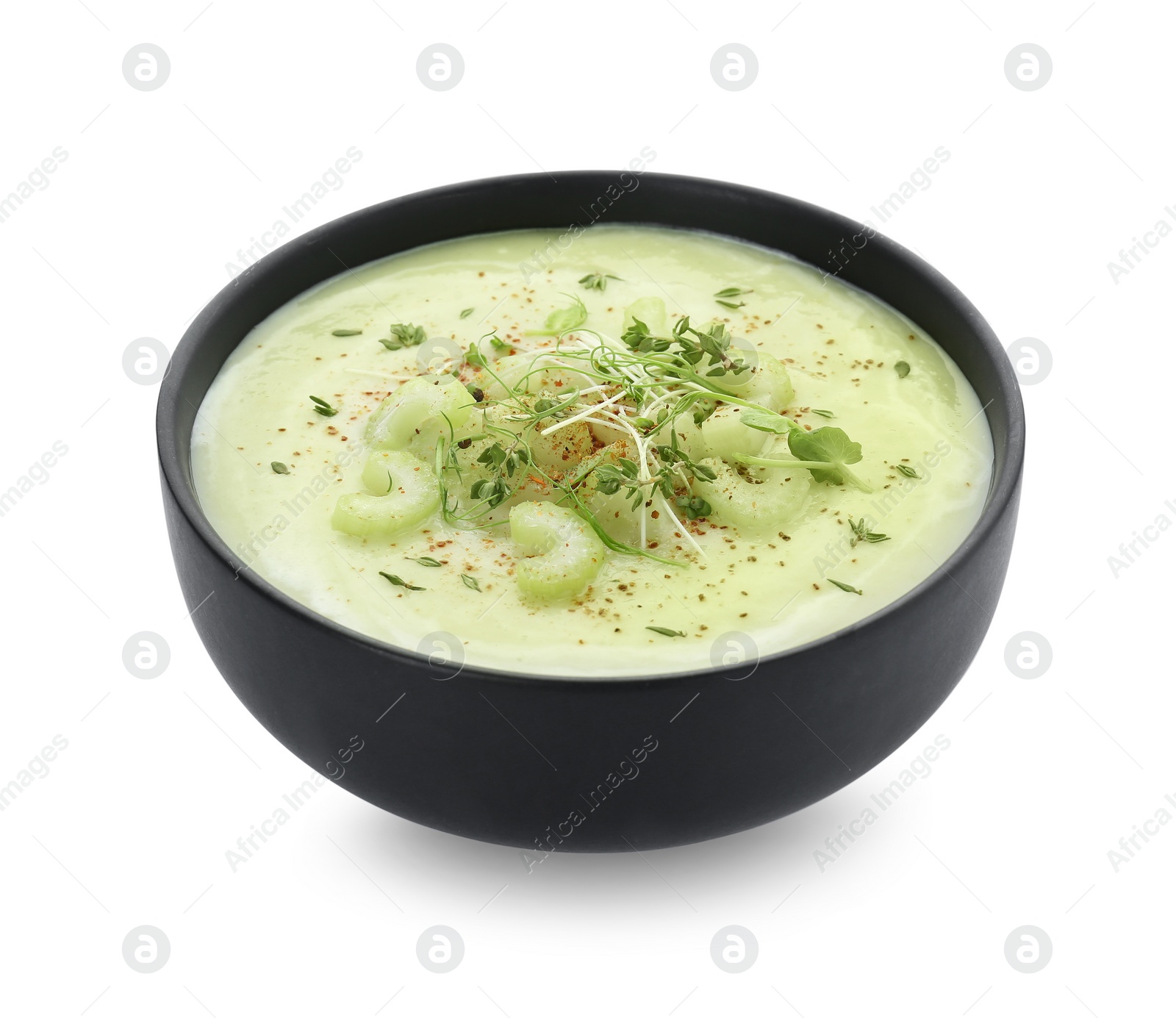 Photo of Bowl of delicious celery soup isolated on white