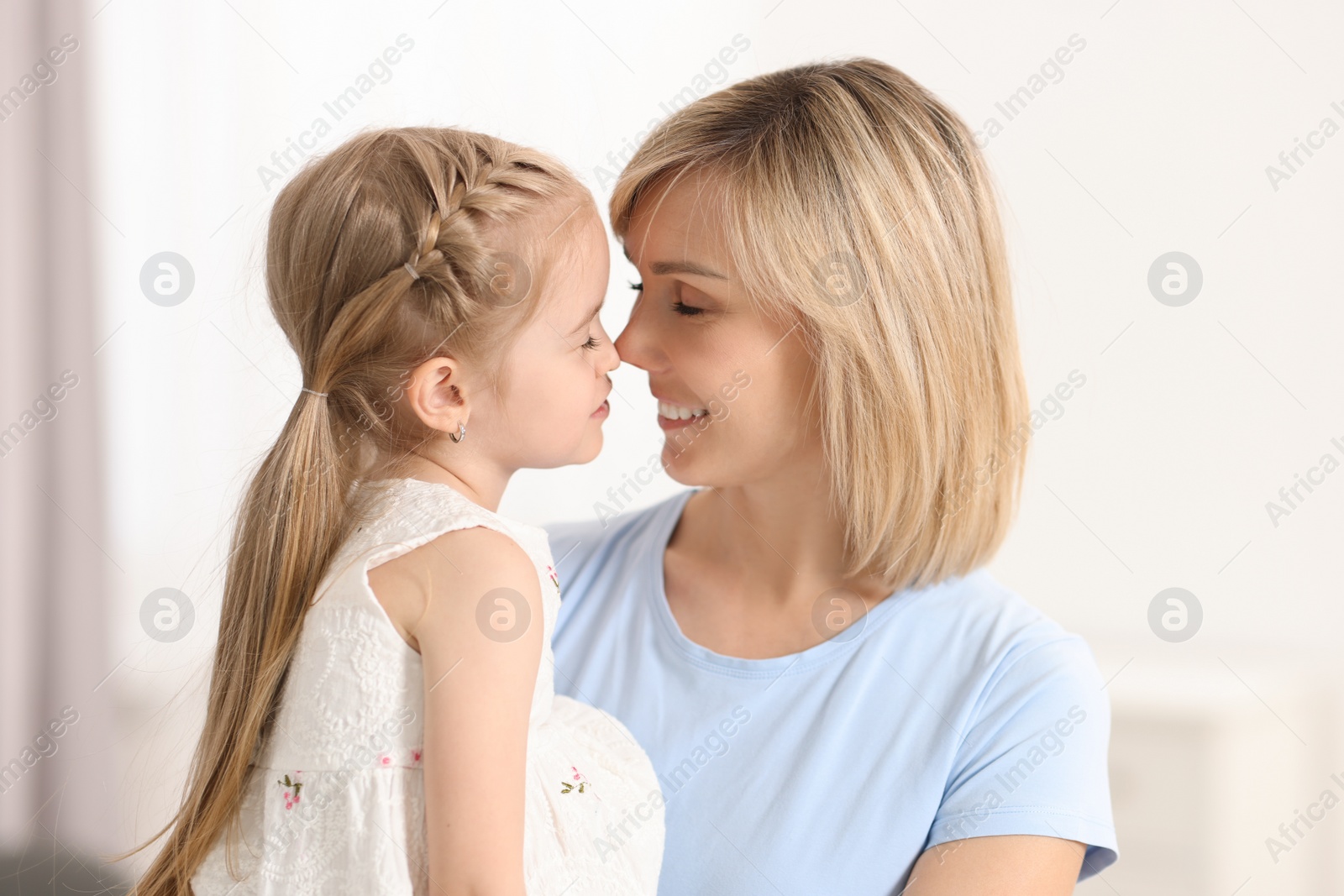 Photo of Happy mother and her daughter at home