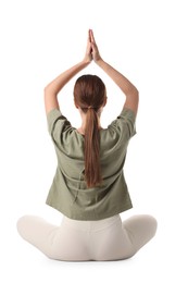 Young woman meditating on white background, back view