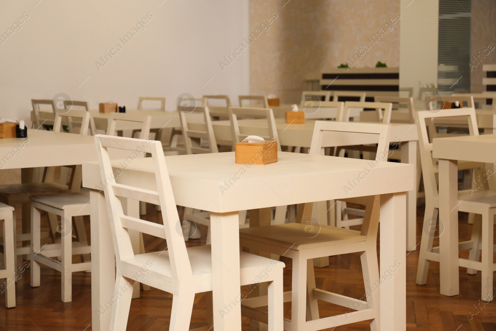 Photo of Stylish interior of school canteen with new furniture