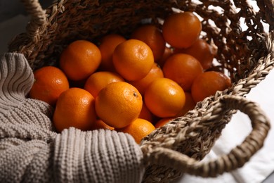 Photo of Net bag with many fresh ripe tangerines, above view