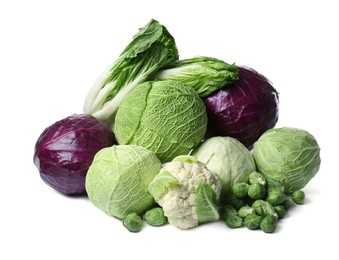 Photo of Many different fresh ripe cabbages on white background