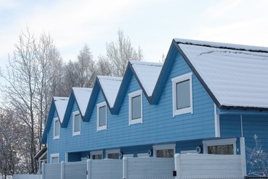 Photo of House roofs covered with snow in winter morning