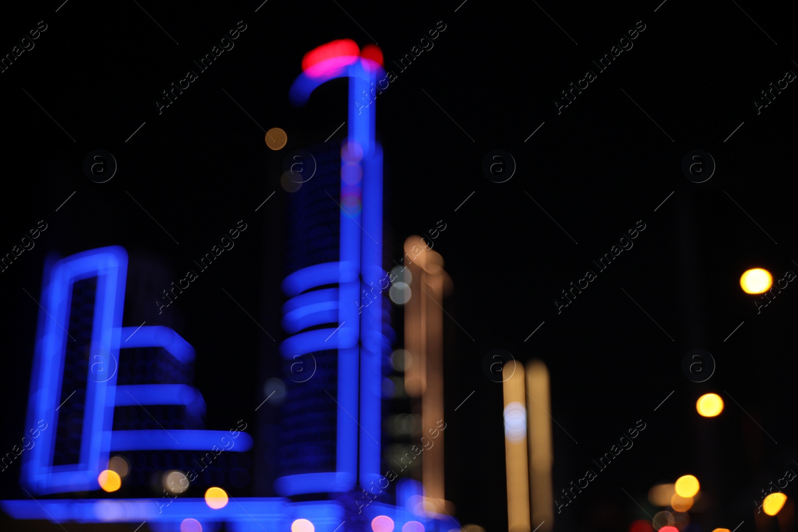 Photo of Blurred view of cityscape with bokeh effect. Night life