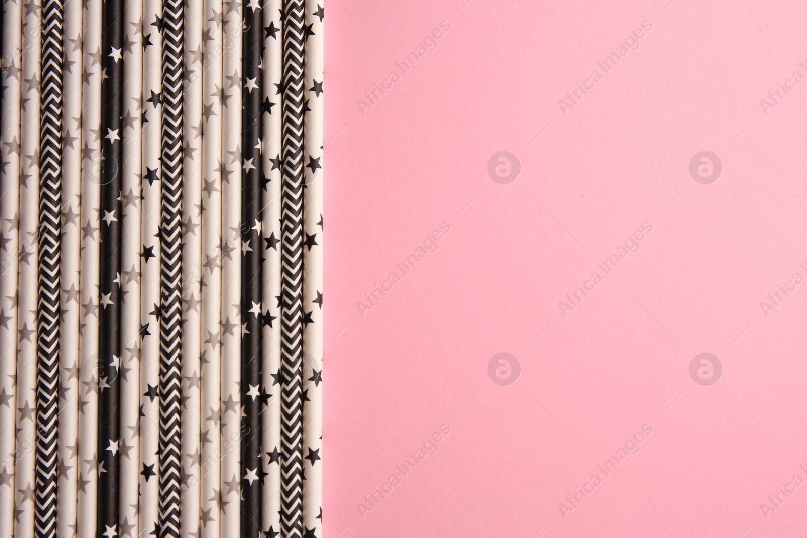Photo of Many paper drinking straws on pink background, flat lay. Space for text