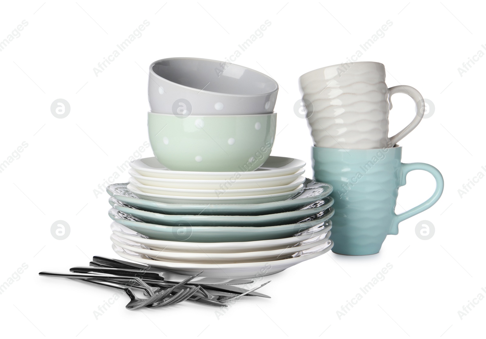 Photo of Set of beautiful ceramic dishware and cutlery isolated on white