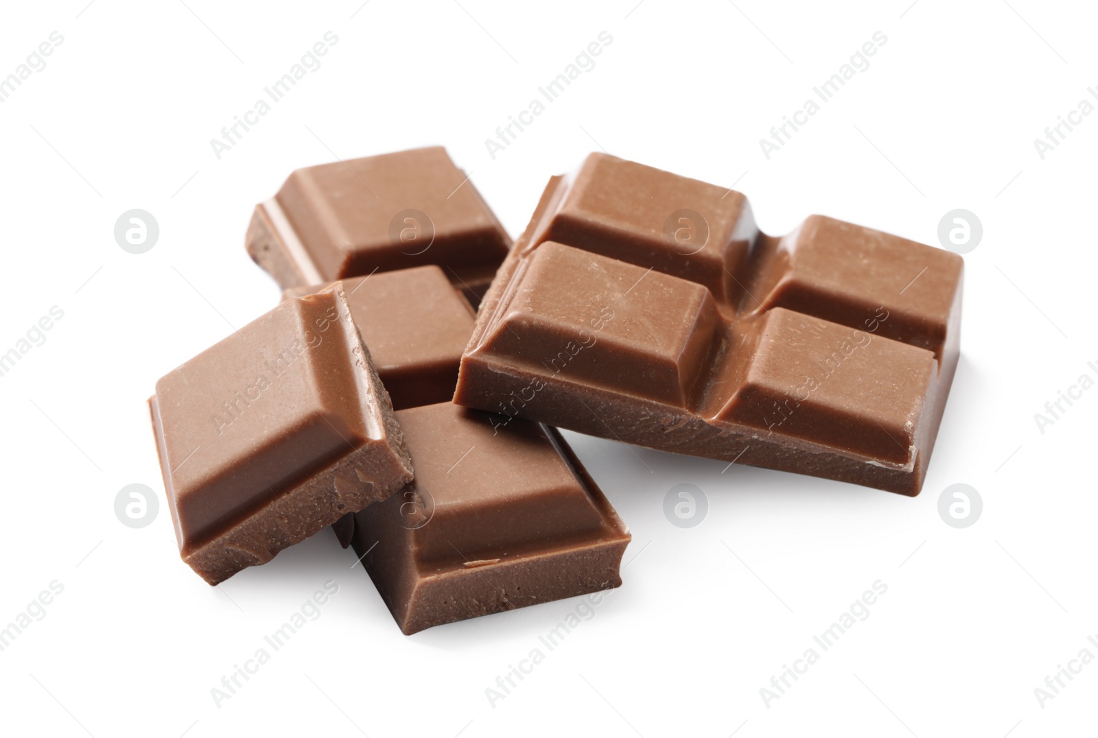 Photo of Pieces of delicious milk chocolate isolated on white