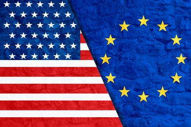 Image of Flags of USA and European Union on stone wall. International diplomatic relationships