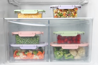 Photo of Boxes with different products inside of refrigerator