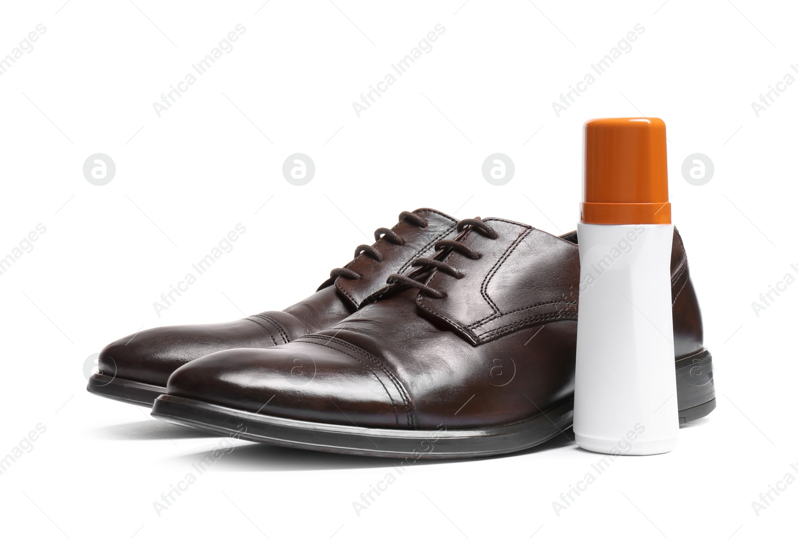 Photo of Stylish men's shoes and cream on white background