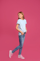 Photo of Full length portrait of preteen girl on pink background