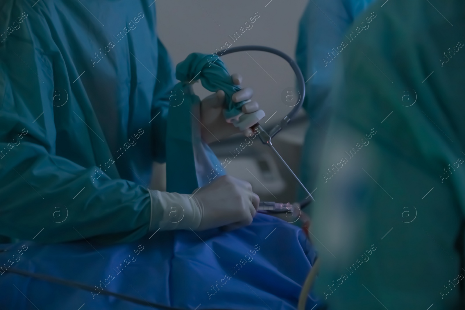 Photo of Professional doctors performing 
operation in surgery room, closeup