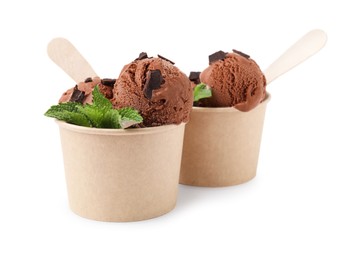 Photo of Paper cups with tasty chocolate ice cream, sticks and mint leaves isolated on white