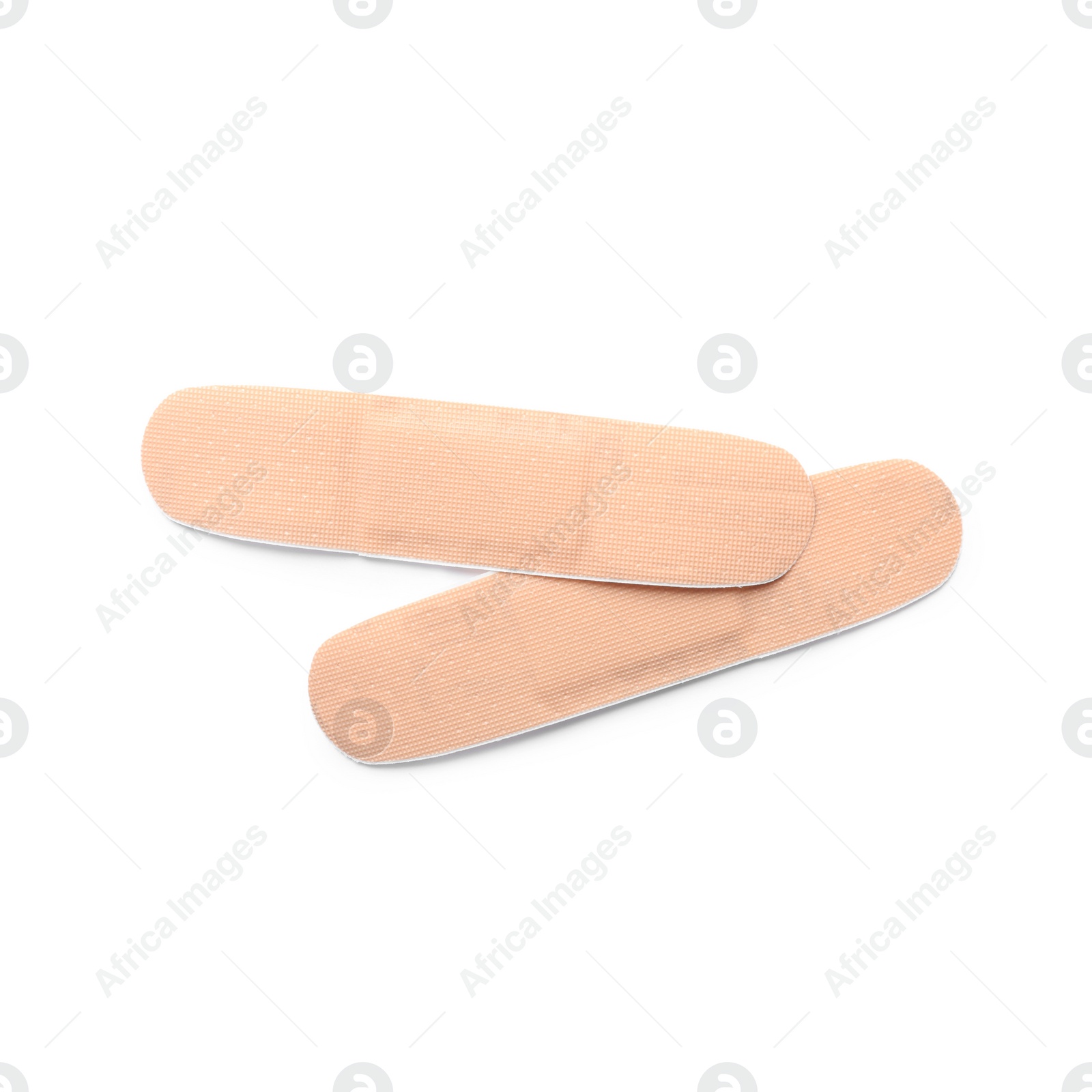 Medical sticking plasters isolated on white. First aid item Photo of Medical sticking plasters isolated on white. First aid item
