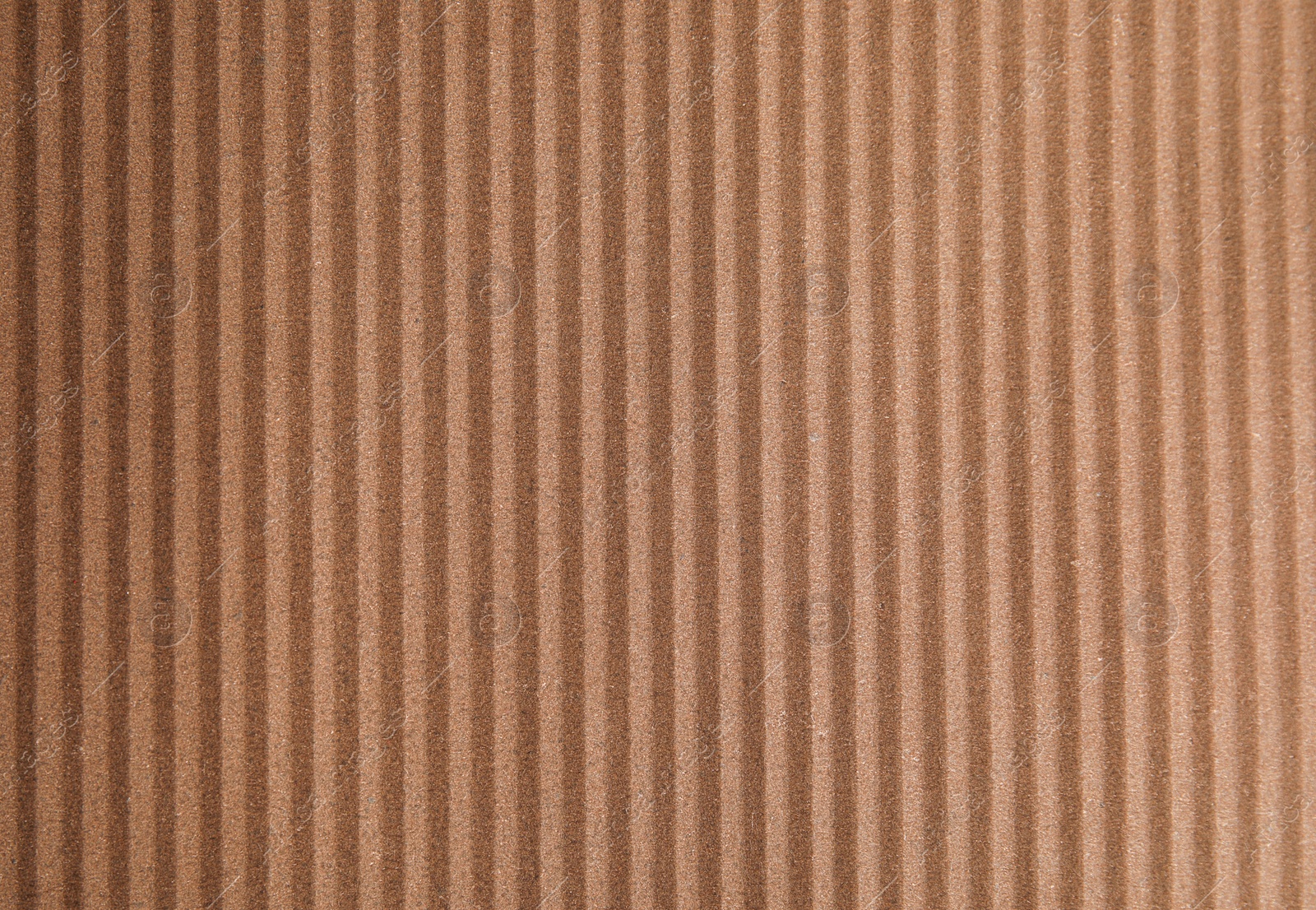 Photo of Brown corrugated sheet of cardboard as background, top view