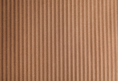 Brown corrugated sheet of cardboard as background, top view