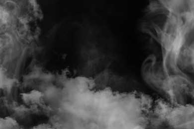 White smoke on black background. Space for text