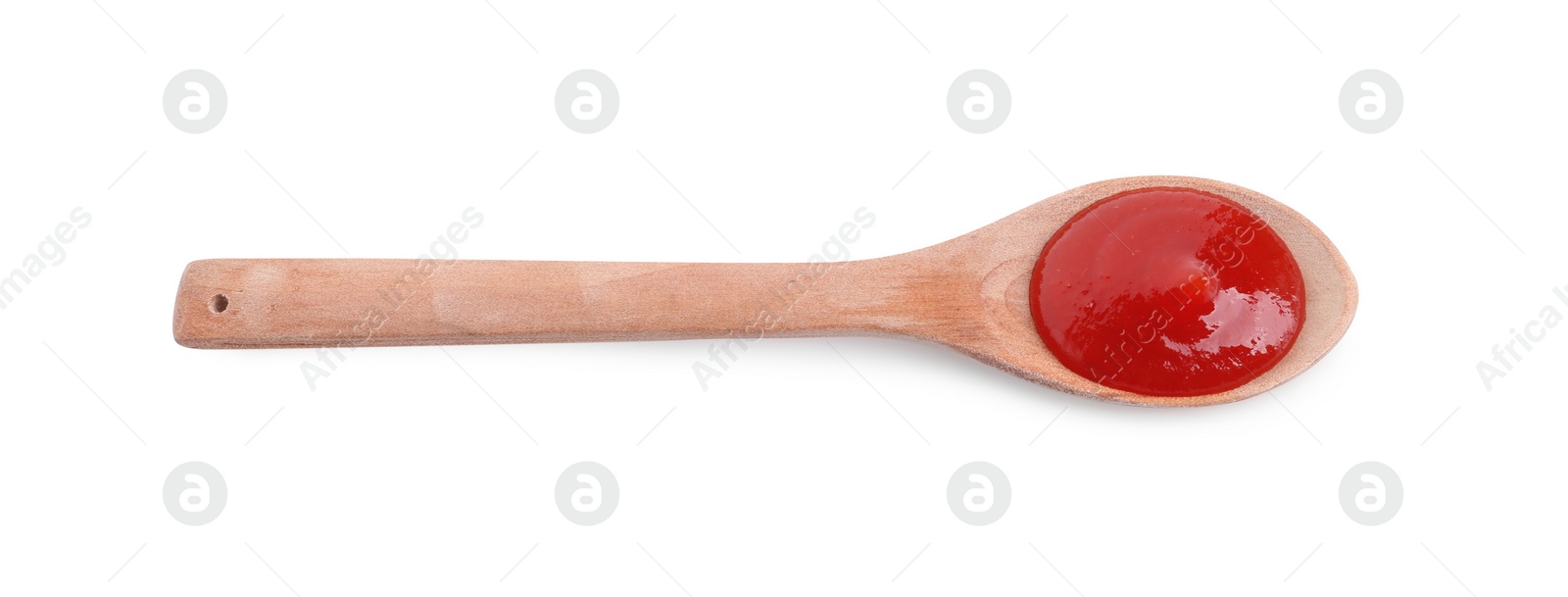 Photo of Spoon with tasty ketchup isolated on white, top view. Tomato sauce