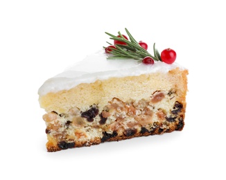 Slice of traditional Christmas cake decorated with rosemary and cranberries isolated on white