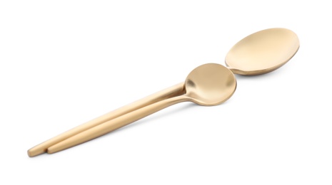 Photo of Elegant shiny golden spoons isolated on white