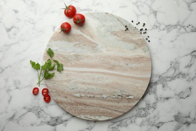 Photo of Cutting board, parsley, pepper and tomatoes on white marble table, flat lay. Space for text