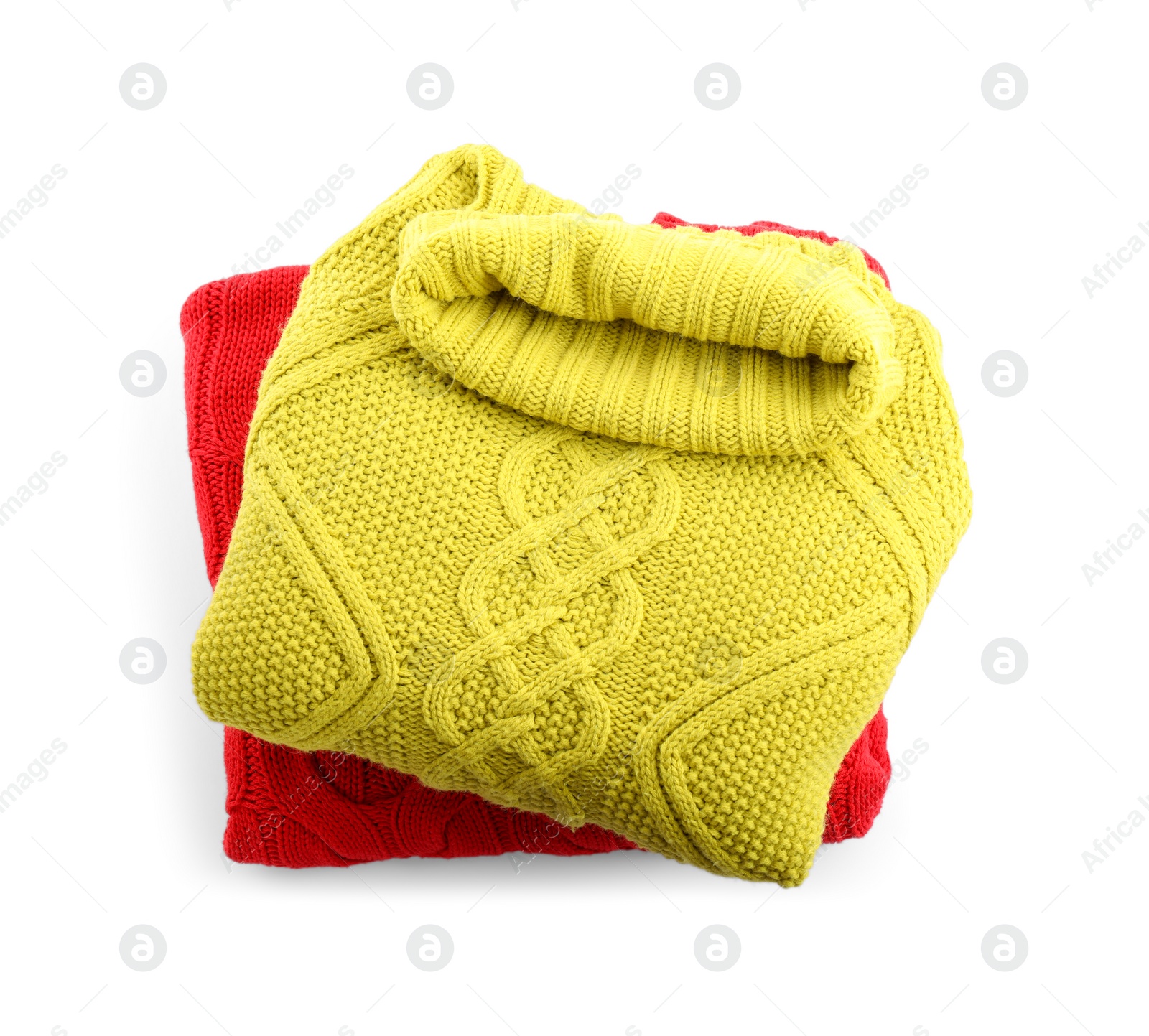 Photo of Stack of different warm sweaters isolated on white, top view