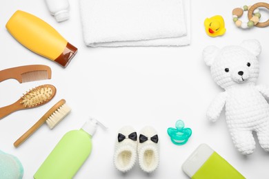 Flat lay composition with baby cosmetic products on white background, space for text