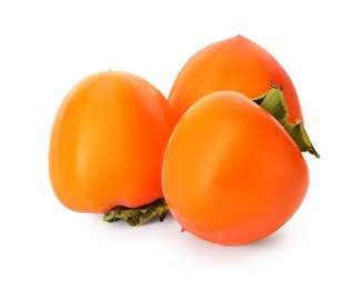 Delicious ripe juicy persimmons on white background