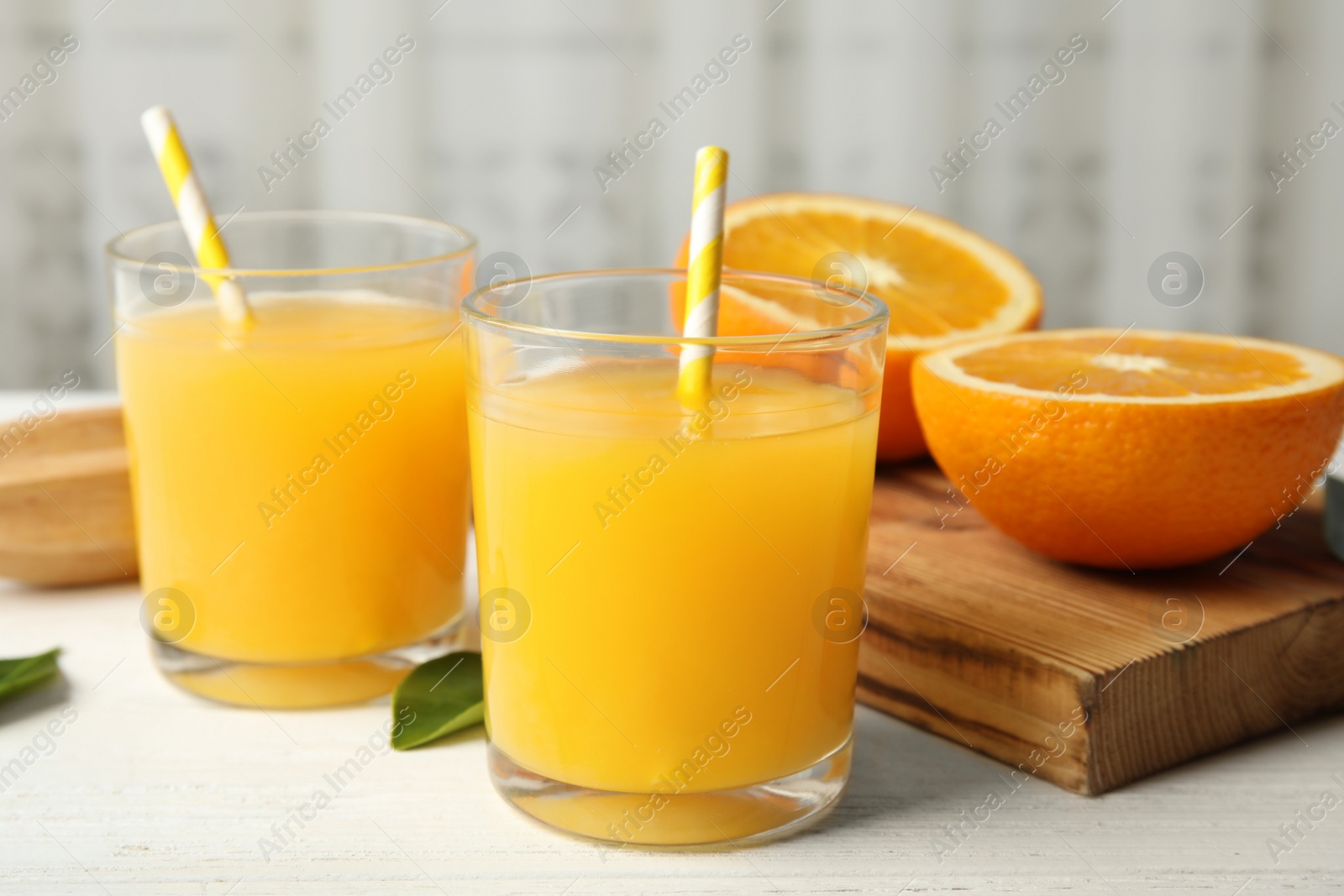 Photo of Composition with orange juice and fresh fruit on table