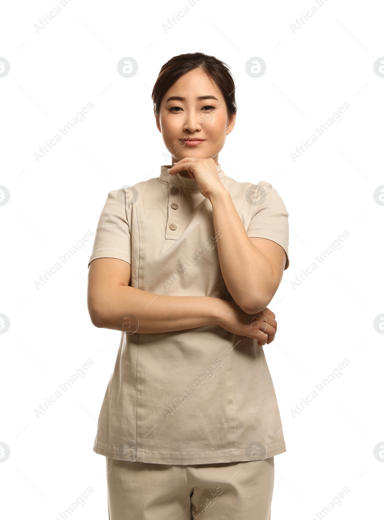 Photo of Professional masseuse in spa uniform on white background