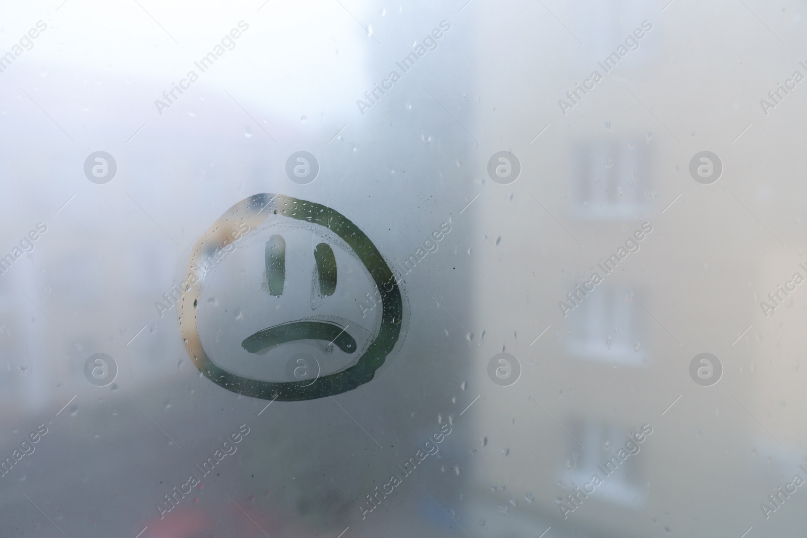 Photo of Sad face drawn on foggy window, space for text. Rainy weather