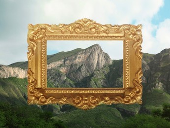 Vintage frame and beautiful mountains under blue sky with clouds