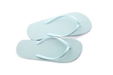 Photo of Stylish light blue flip flops on white background, top view. Beach object