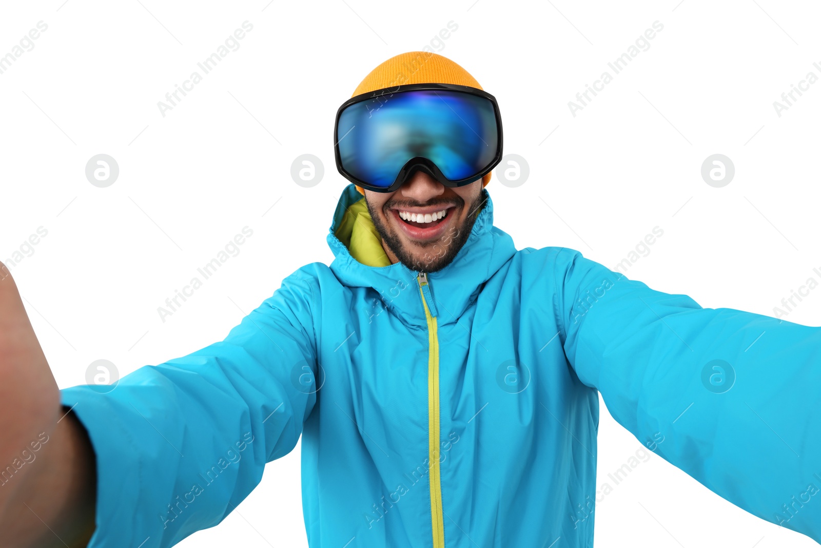 Photo of Smiling young man in ski goggles taking selfie on white background