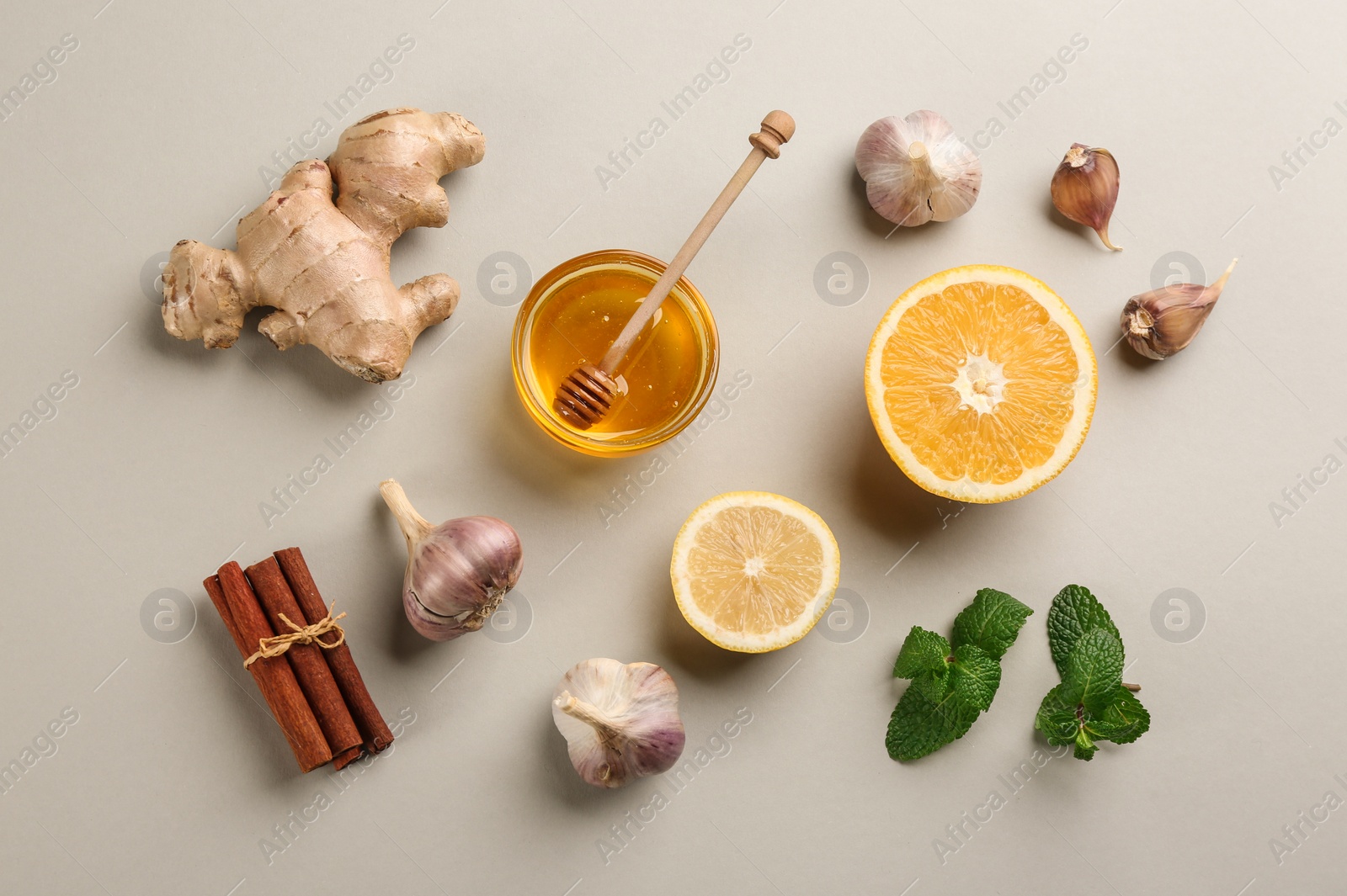 Photo of Flat lay composition with fresh products on grey background. Natural antibiotics