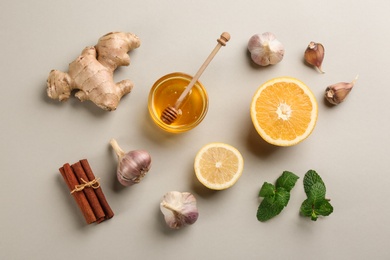 Photo of Flat lay composition with fresh products on grey background. Natural antibiotics