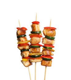 Delicious chicken shish kebabs with vegetables on white background