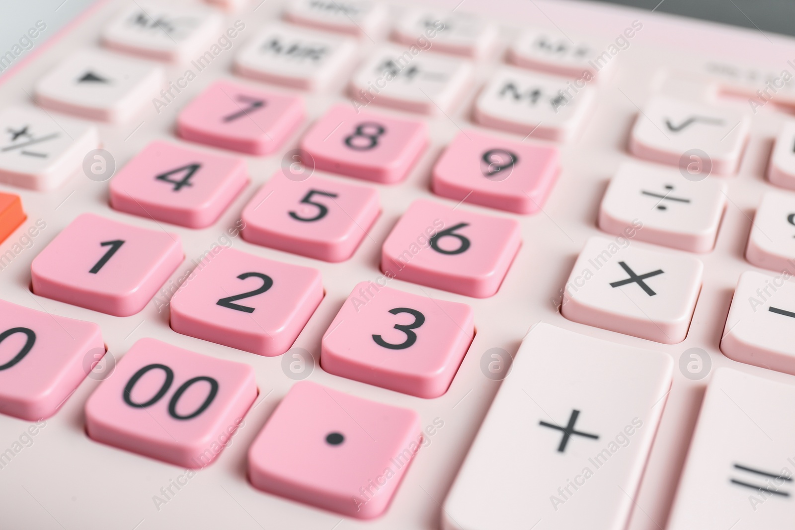 Photo of Closeup view of pink calculator as background