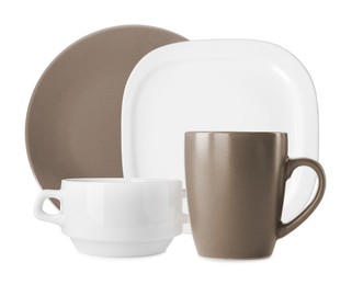 Set of stylish ceramic dinnerware on white background