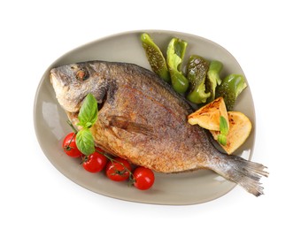 Photo of Delicious roasted dorado fish, vegetables, and lemon isolated on white, top view