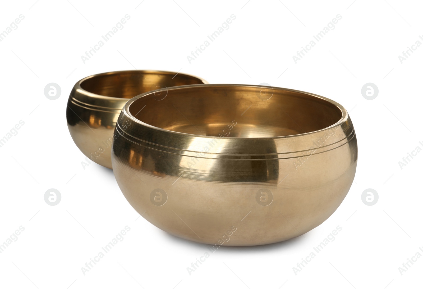 Photo of Two Tibetan singing bowls on white background