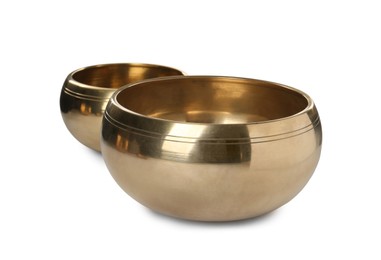 Two Tibetan singing bowls on white background