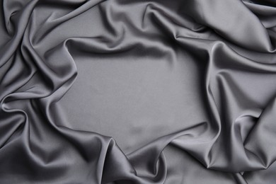 Photo of Texture of delicate black silk as background, top view