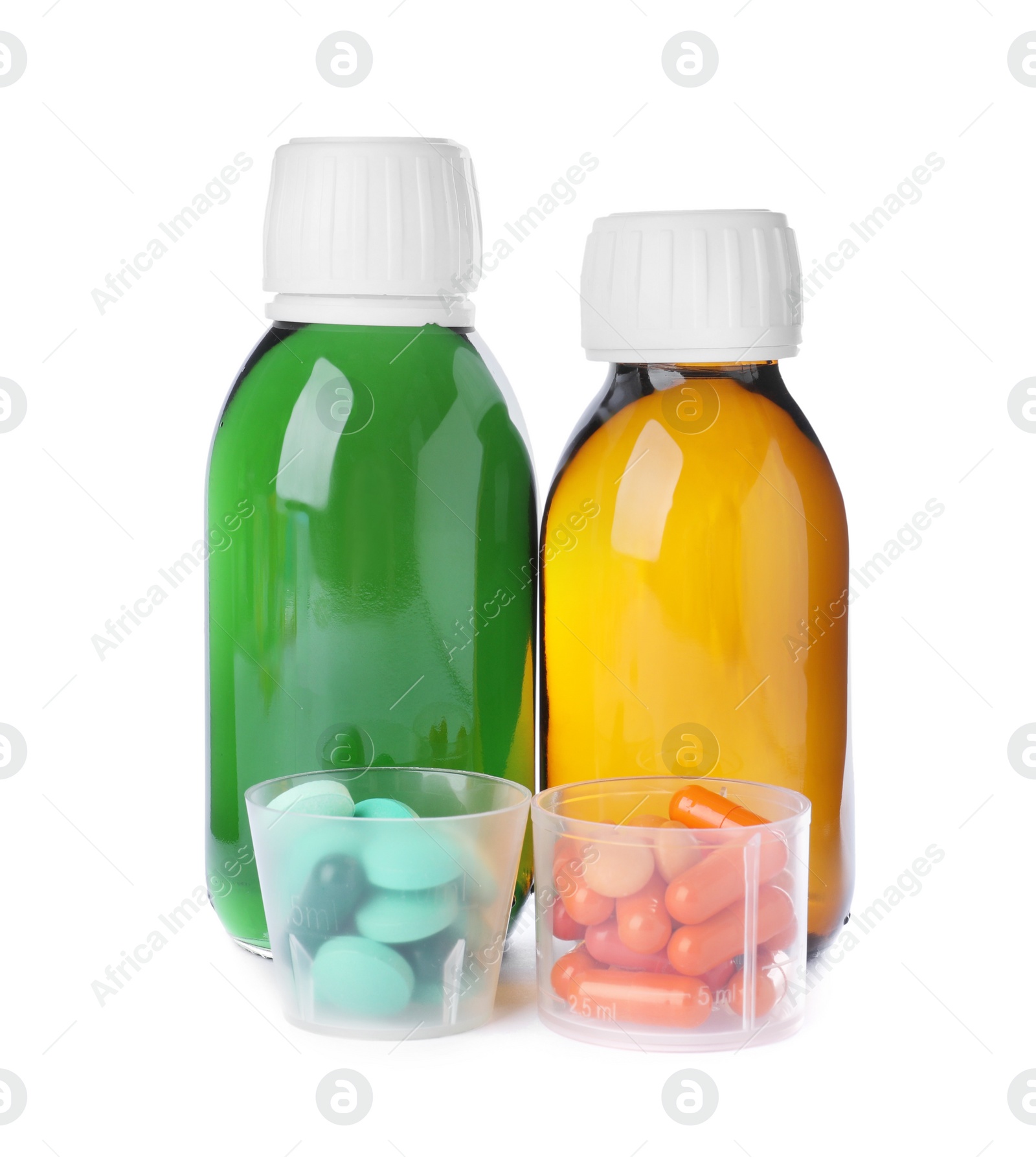 Photo of Bottles of syrups with pills on white background. Cough and cold medicine