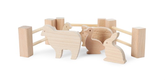 Photo of Wooden animals and fence isolated on white. Children's toy