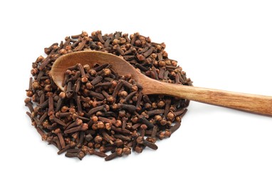 Photo of Pile of aromatic dry cloves and wooden spoon on white background, above view