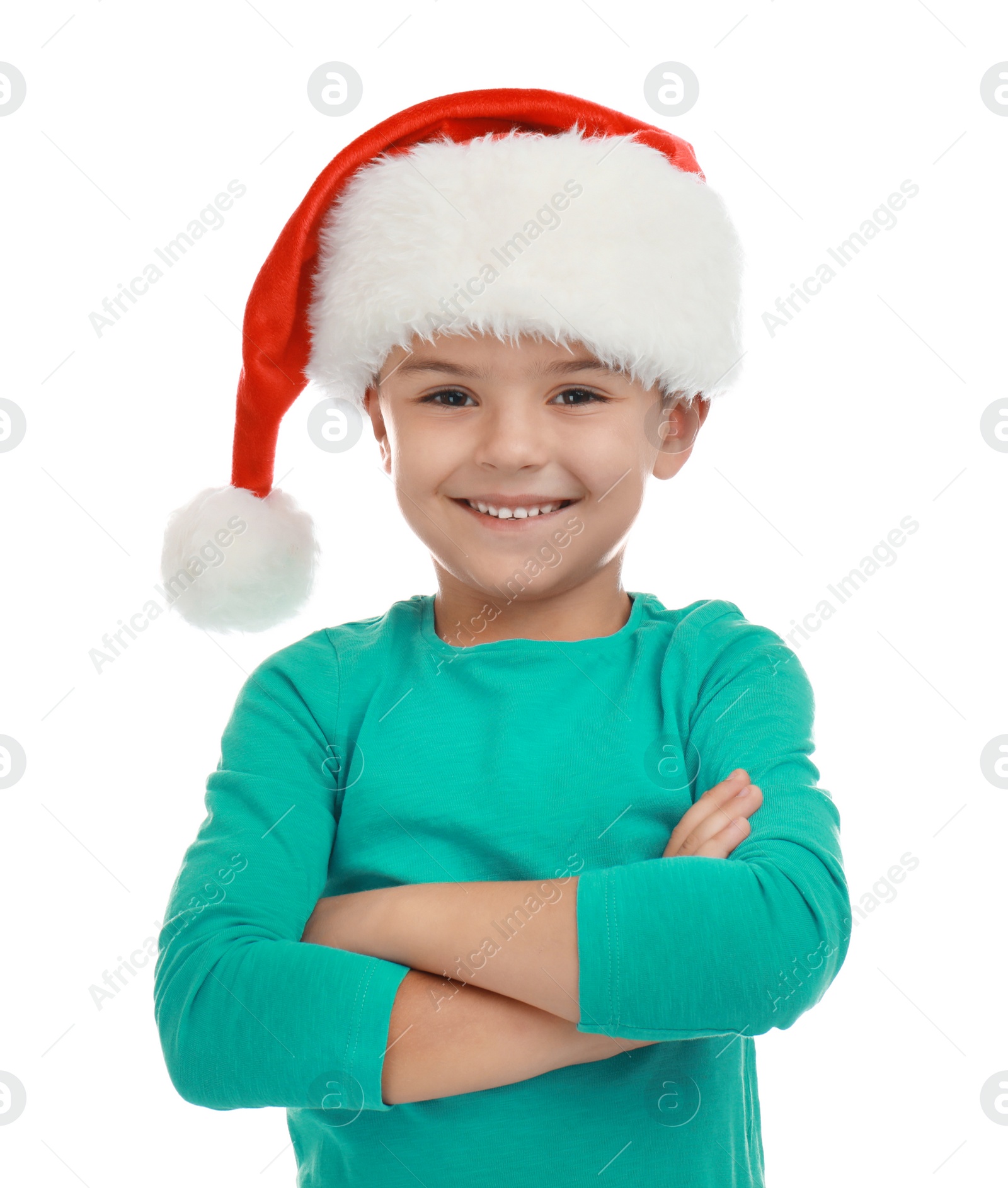 Photo of Cute little child wearing Santa hat on white background. Christmas holiday