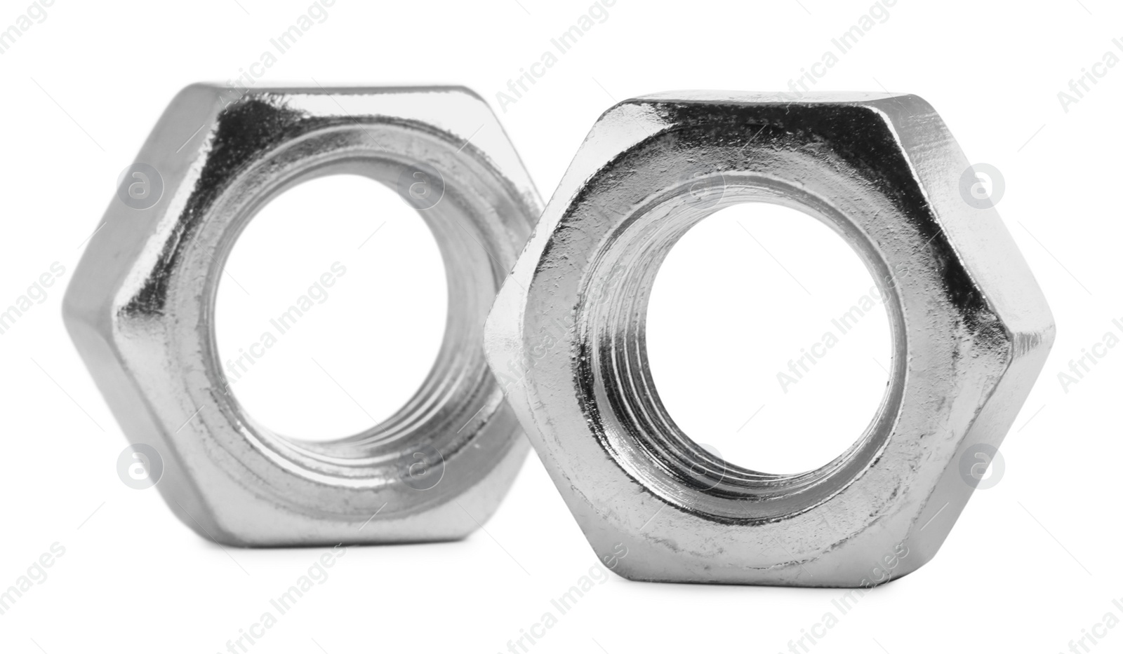 Photo of Two metal hex nuts on white background