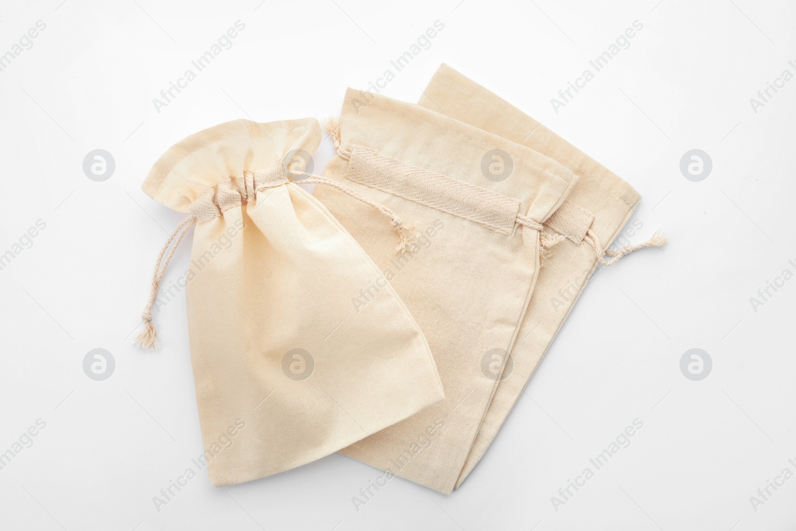 Photo of Cotton eco bags isolated on white, top view