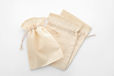 Cotton eco bags isolated on white, top view